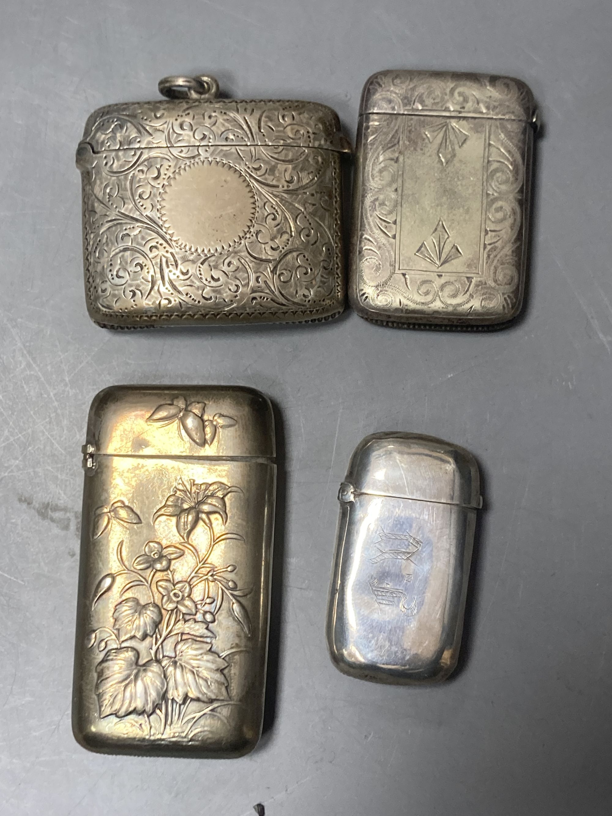 A silver cigarette box, silver cigarette case, four vestas including two silver, a continental dish and a toilet jar.